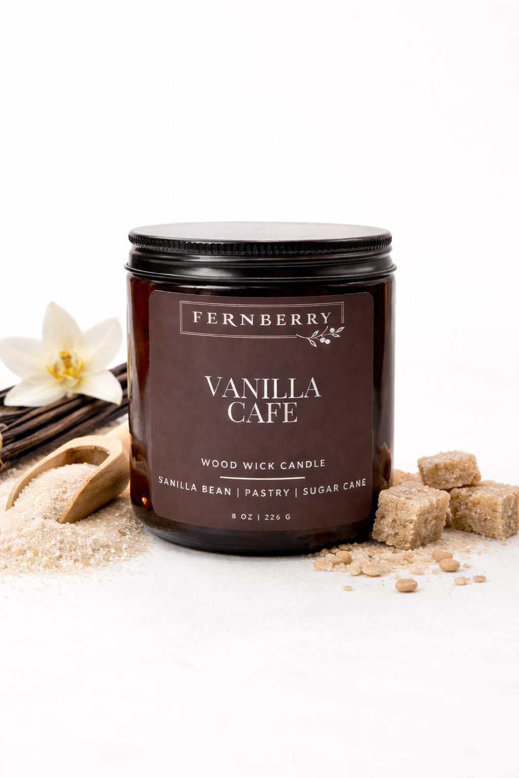 Fernberry Vanilla Cafe candle with vanilla beans and sugar on a white background
