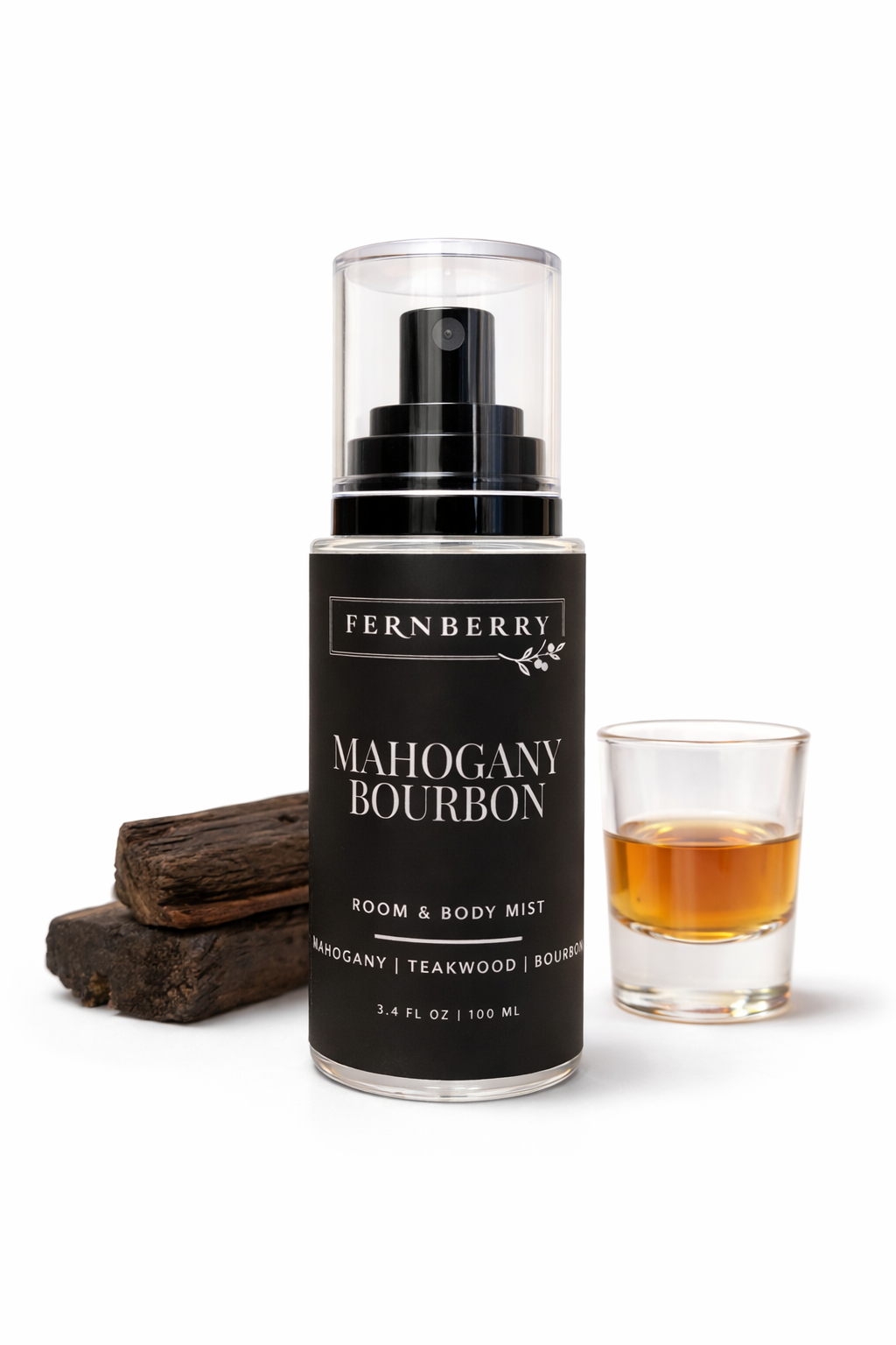 Fernberry Mahogany Bourbon room and body mist with a glass of bourbon on a white background