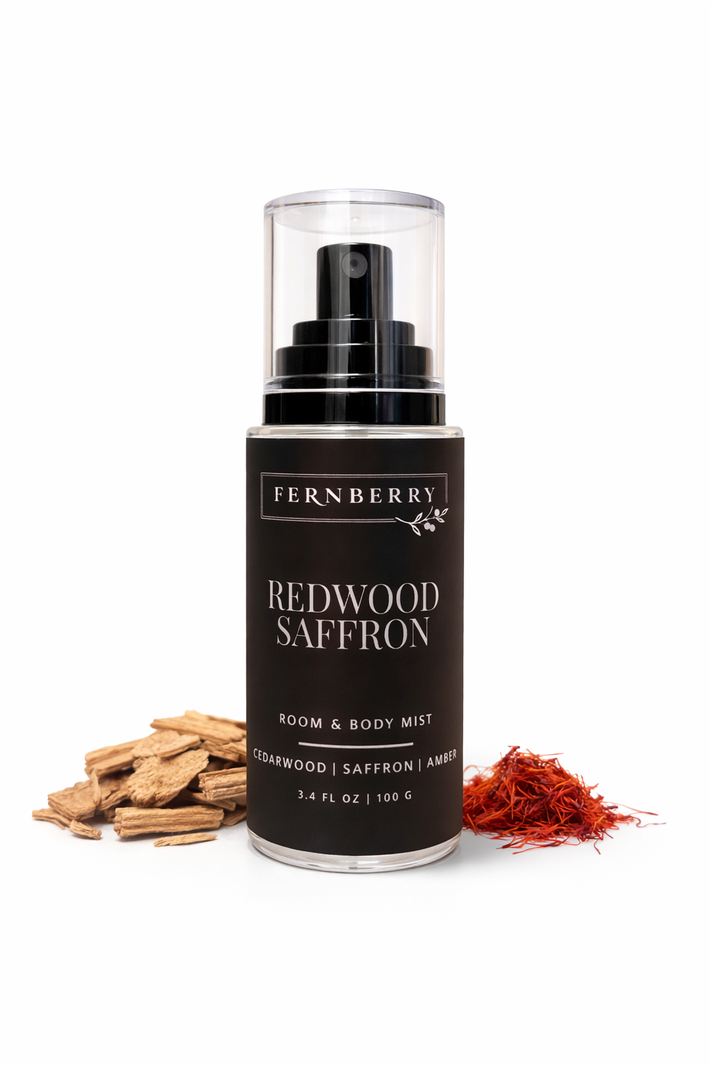 Fernberry Redwood Saffron room & body mist with saffron threads and wood chips on a white background