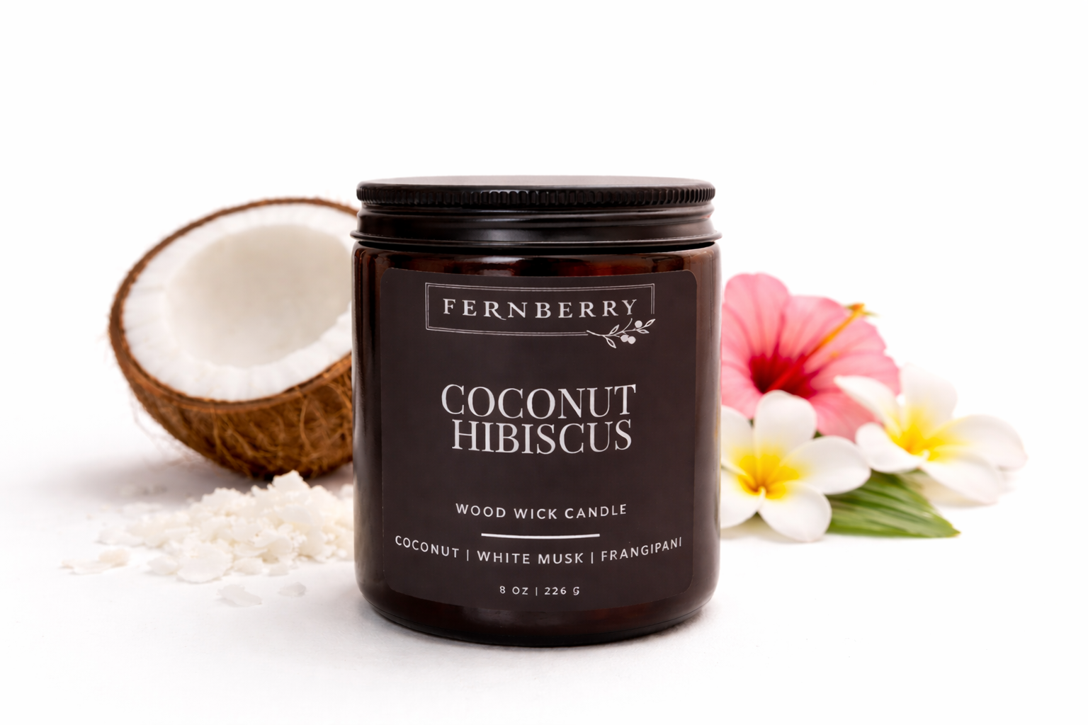 Fernberry Coconut Hibiscus candle with a coconut and flowers on a white background