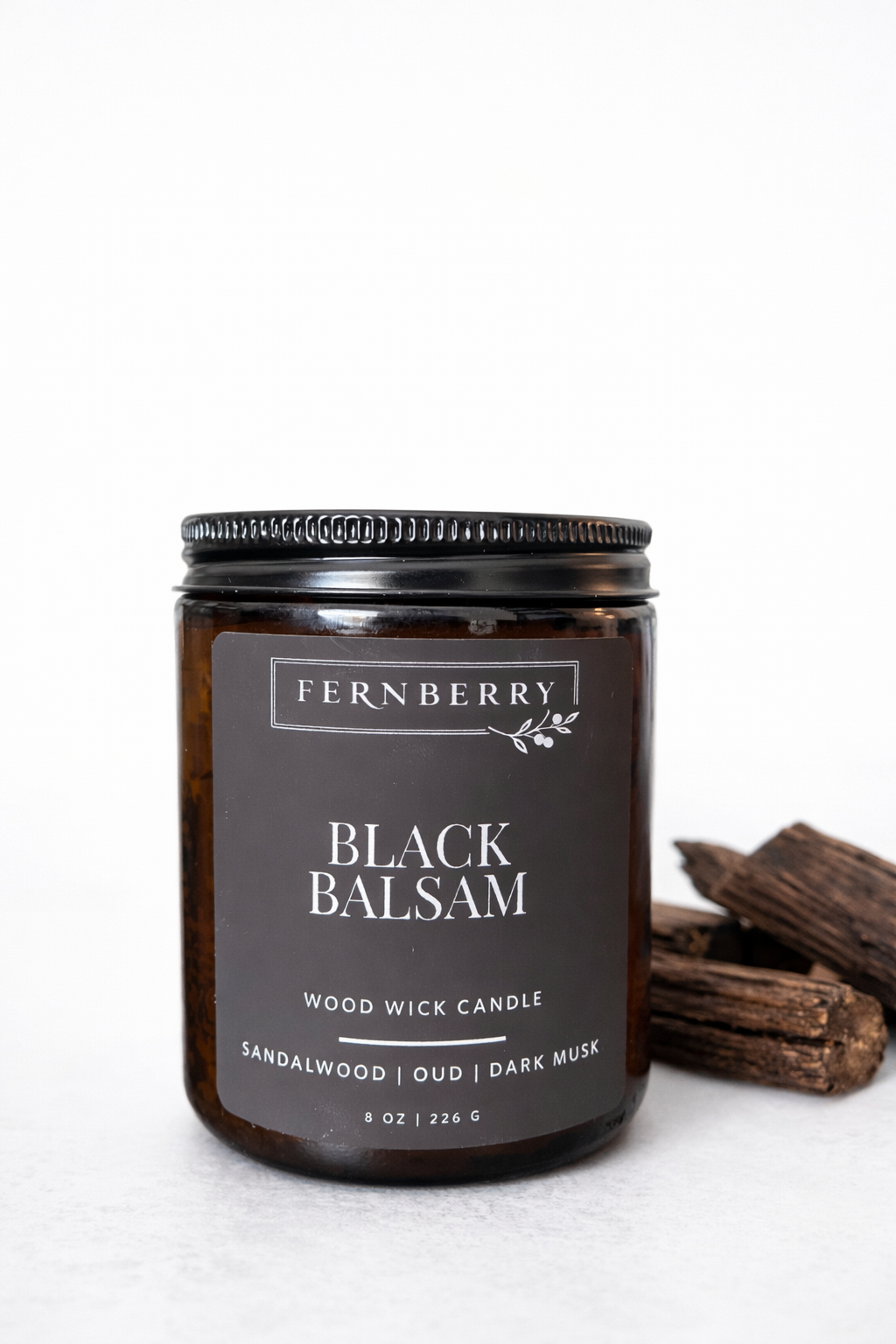 Fernberry Black Balsam candle with wood wick on a white background
