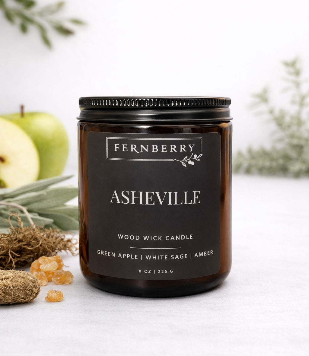 Fernberry Asheville candle with natural elements on a light background