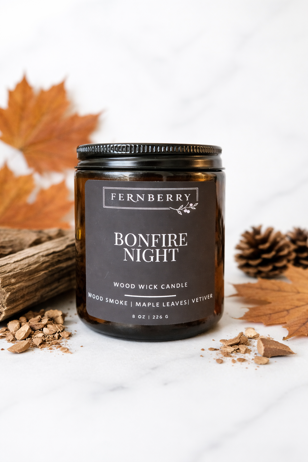 Fernberry Bonfire Night candle with autumn elements on a white background