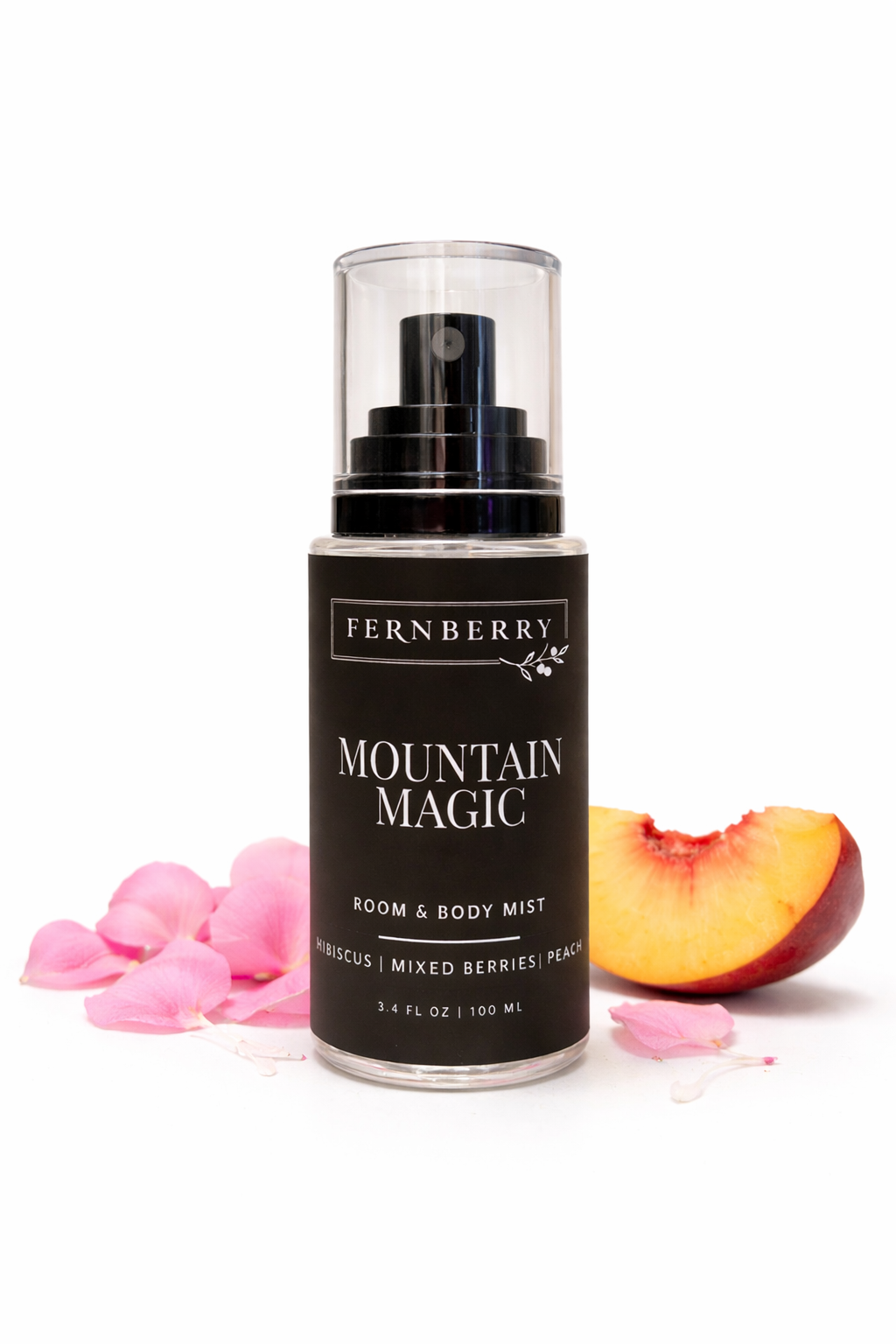 Fernberry Mountain Magic room and body mist with pink flowers and a peach slice on a white background