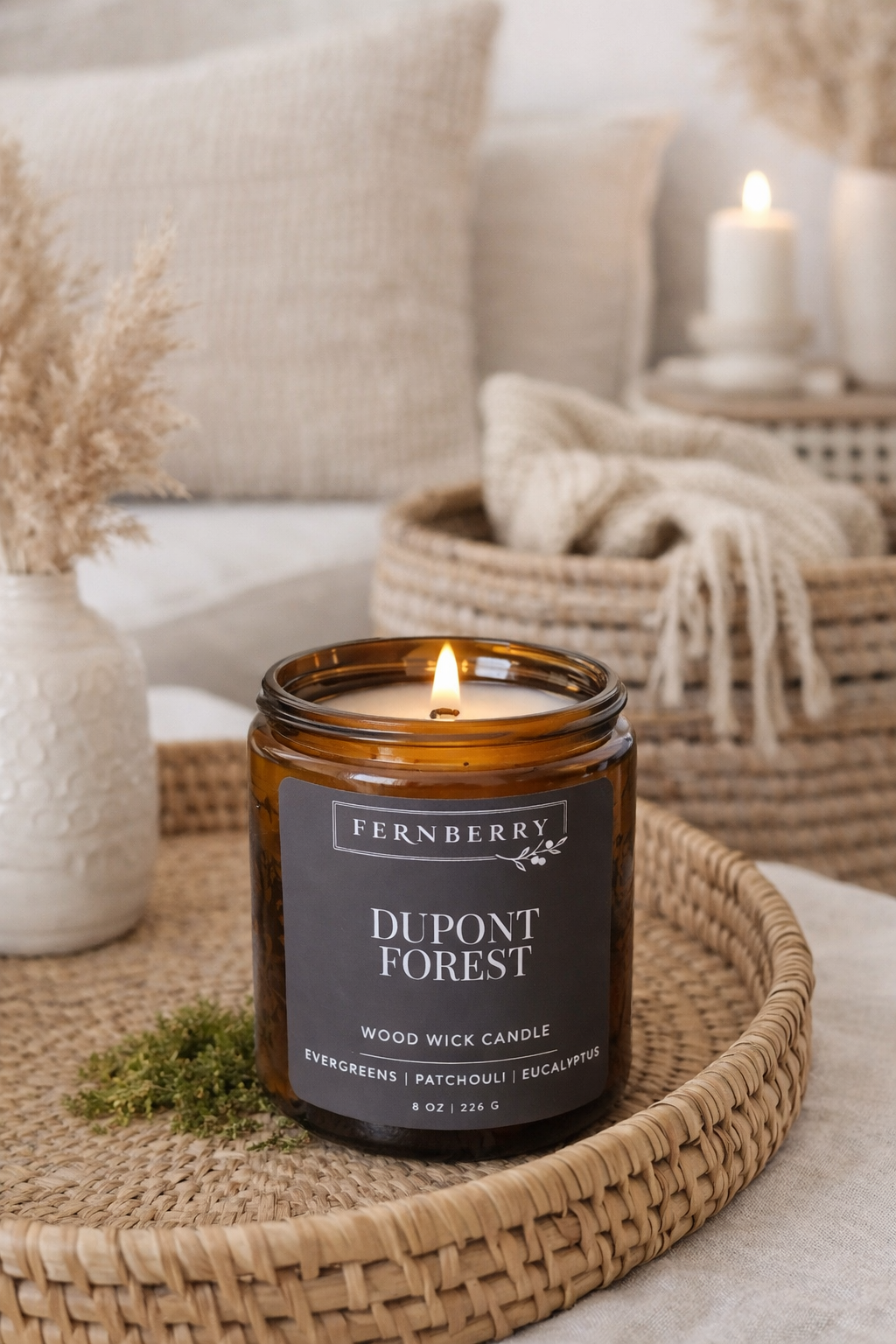 Fernberry Dupont Forest candle on a woven tray with a cozy background