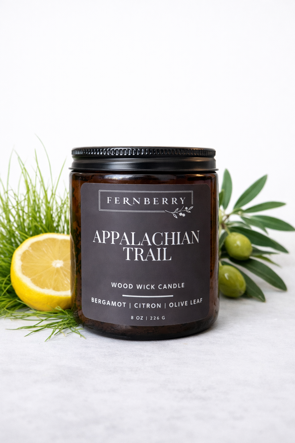 Fernberry Appalachian Trail candle with lemon and olive branches on a white background